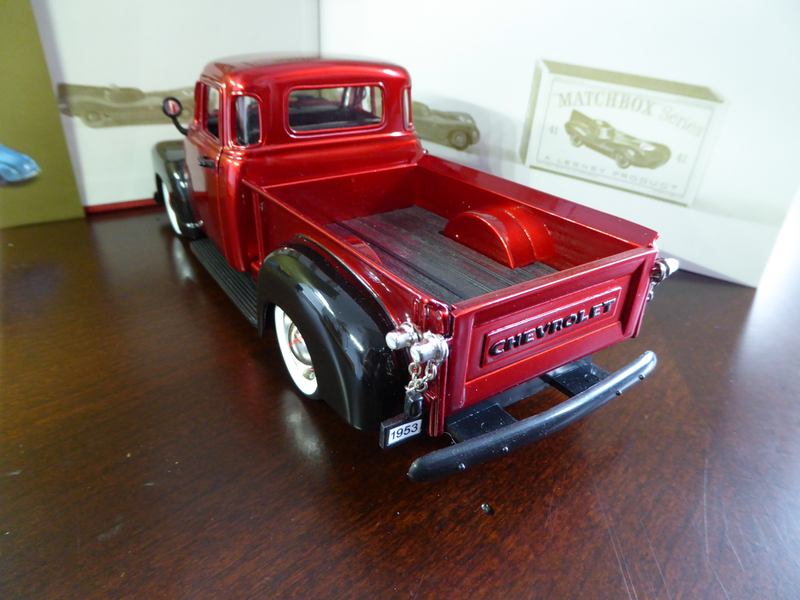 The license plate holder and bumper are separate parts. Only one rear light and is molded with the license plate holder.